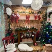 santa’s grotto Cosy festive room decorated with Christmas tree and stockings